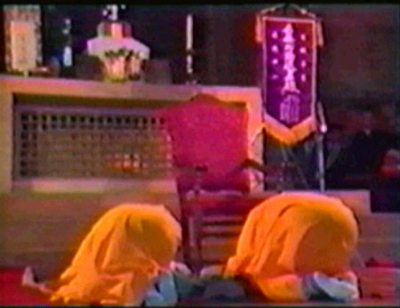 Buddhist monks prostrate before the altar